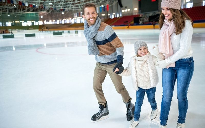 Family trying different outdoor activities, like ice skating, in Stratford