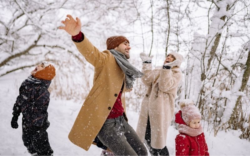 Family having fun in Stratford in the Winter at Winterfest